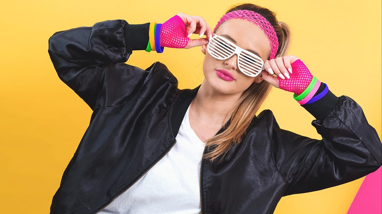 1980s fashion teenager with fishnet gloves and shutter sunglasses. Image produced by More Jersey.