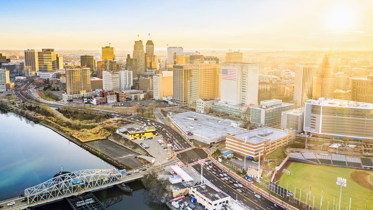 Aerial view of Newark New Jersey skyline during sunrise.