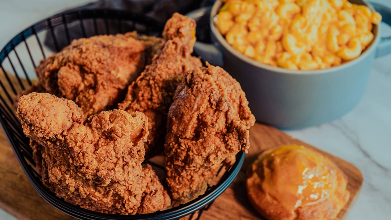 Basket of fried chicken with mac and cheese soul food side dish.