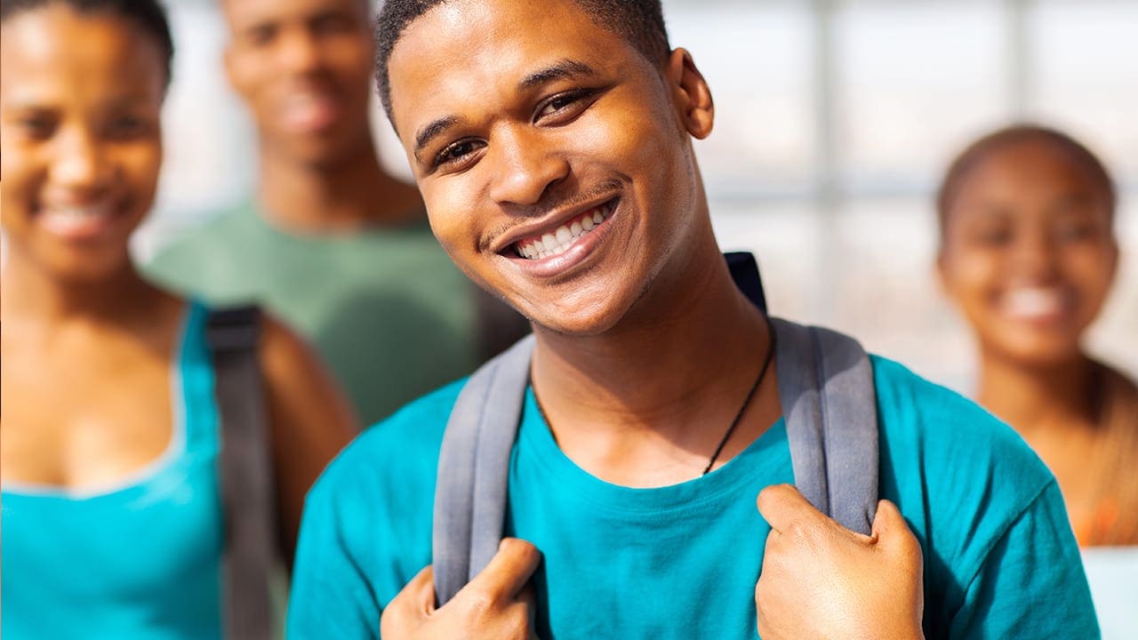 Charismatic black male New Jersey high school or college student with friends. Image produced by More Jersey.