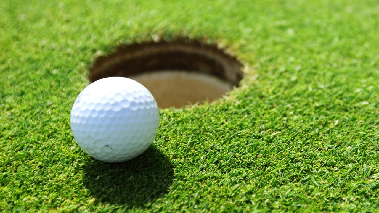 Close-up of a golf ball on a local golf course. Image produced by More Jersey.