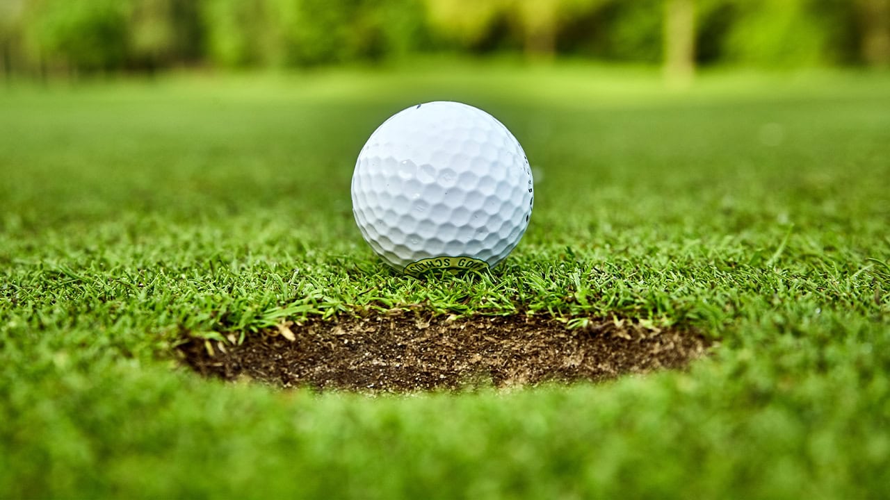 Close-up of a golf ball on a local golf course. Image produced by More Jersey.