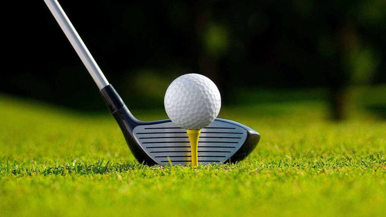 Close-up of a golf club and ball on a golf course in New Jersey. Image produced by More Jersey.