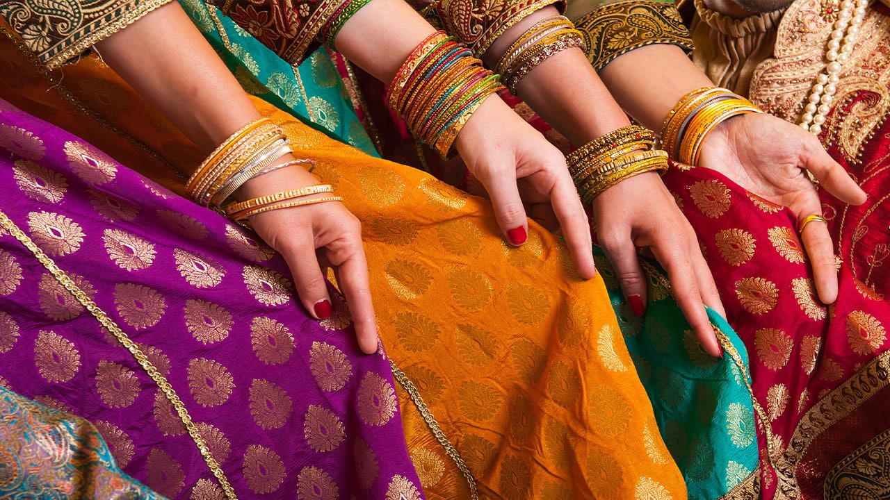Close-up of Bollywood dancers in sari.
