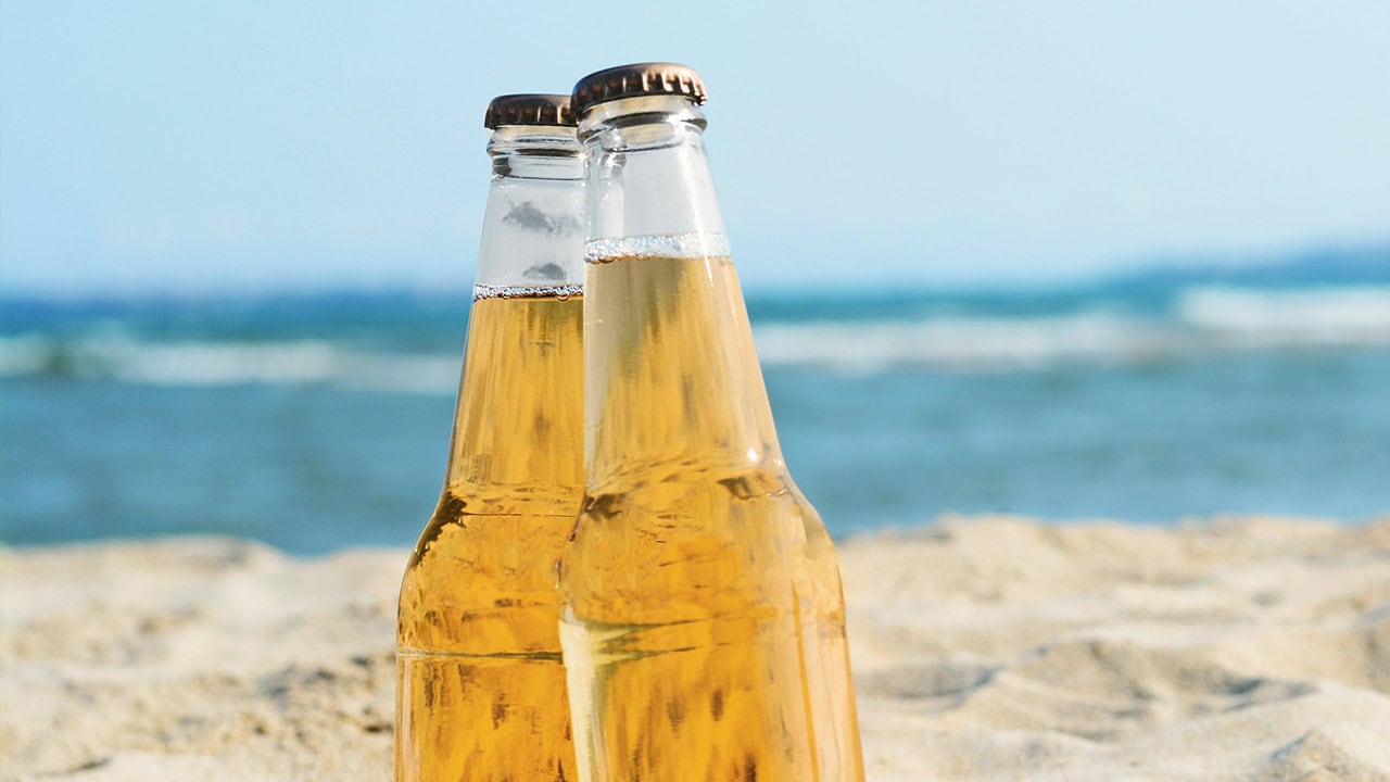 Close-up of cold beers on New Jersey beach.