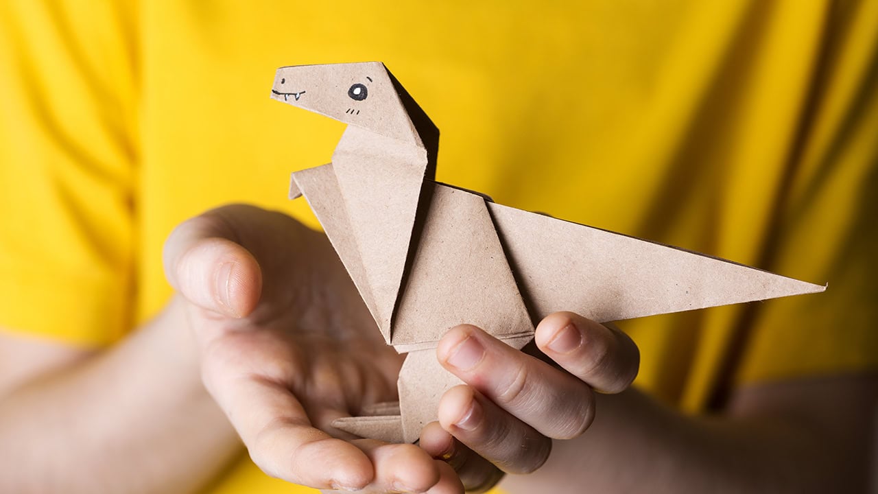Close-up of paper origami dinosaur.