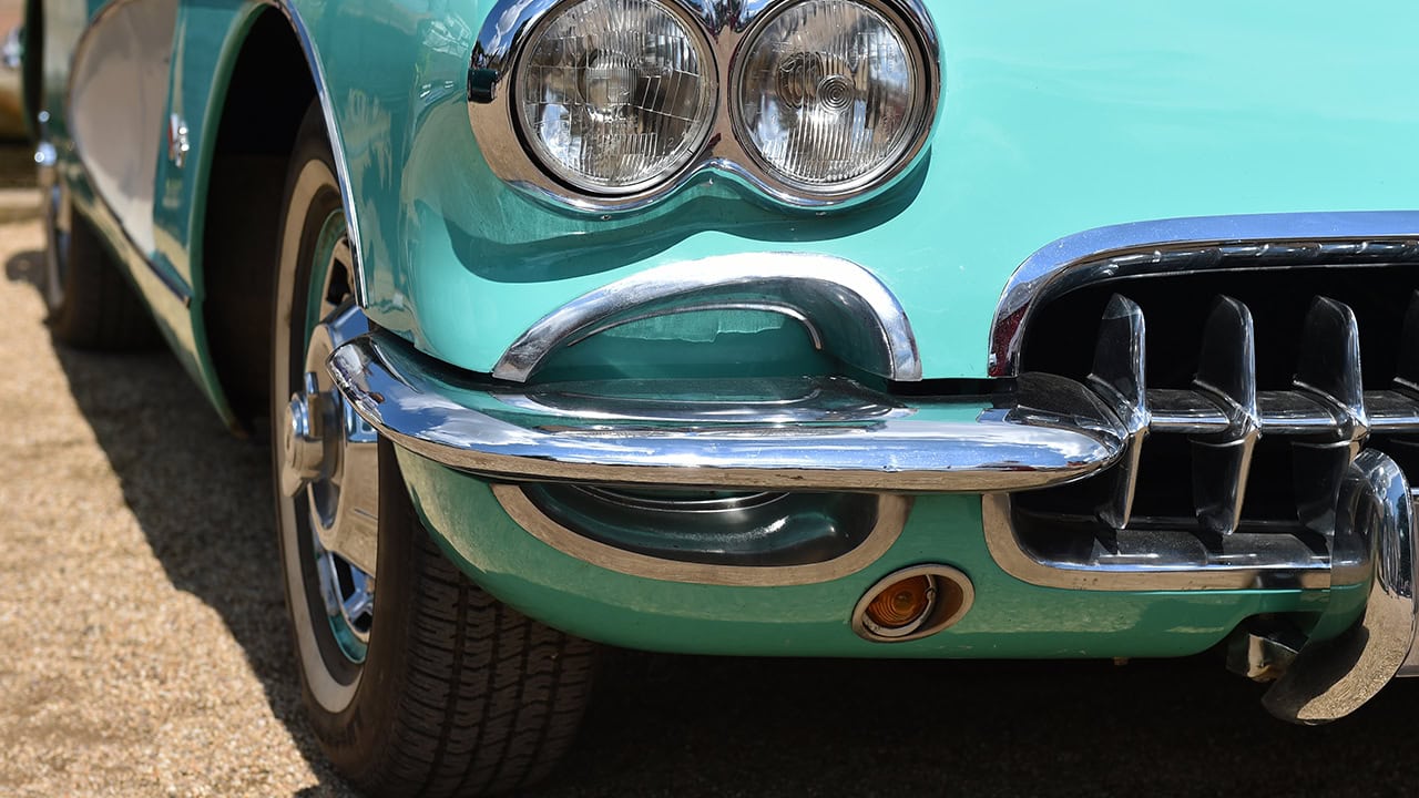 Close-up of shiny turquoise Corvette car. Image produced by More Jersey.