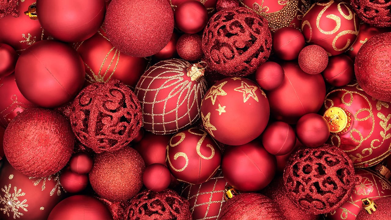 Close-up of an assortment of red Christmas ornaments for New Jersey holiday event. Image produced by More Jersey.