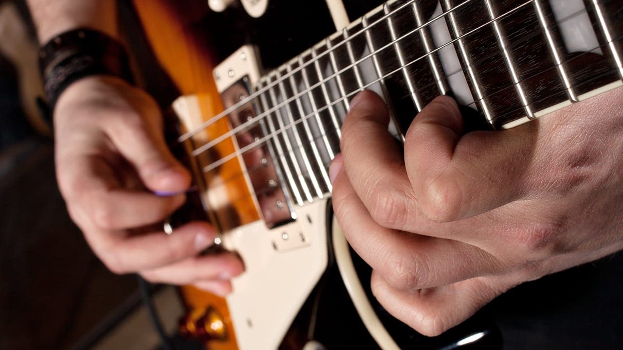 Closeup of New Jersey musician playing electric guitar. Image produced by More Jersey.