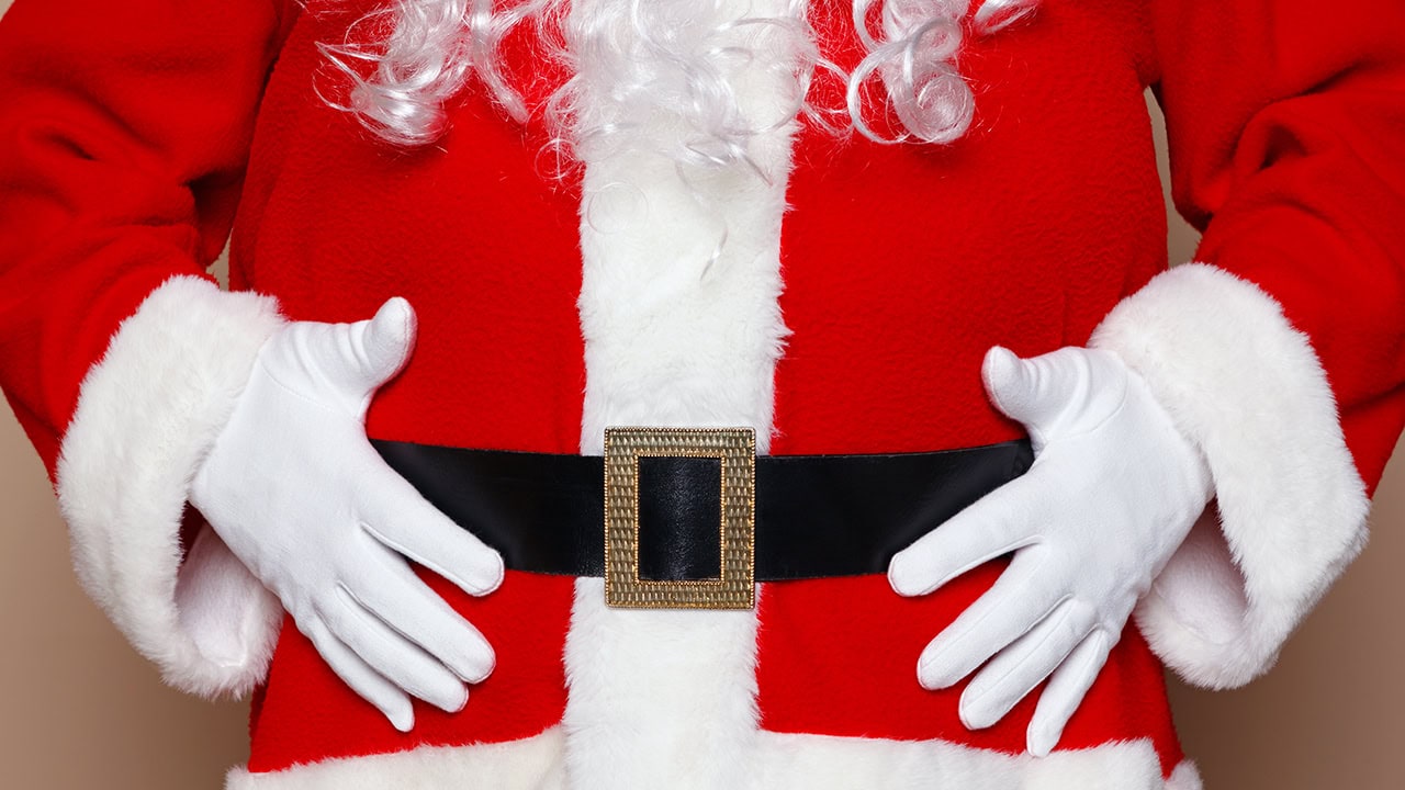 Close-up of Santa Claus holding his belly. Image produced by More Jersey.