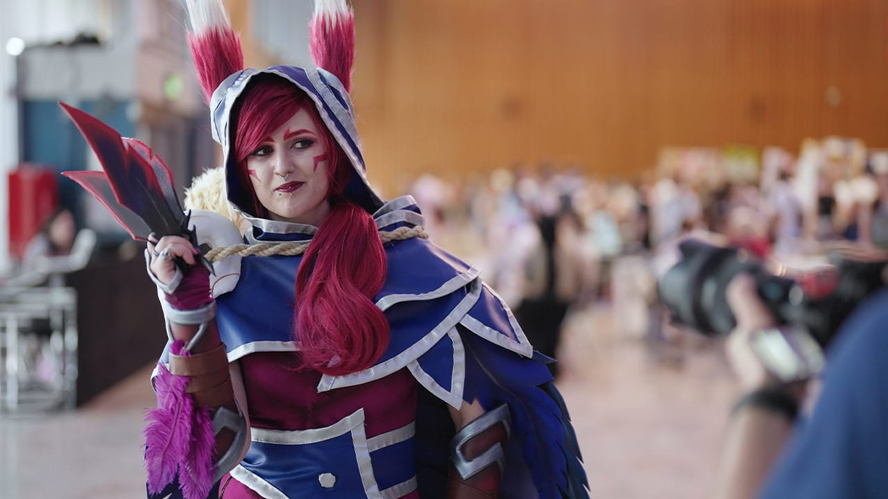 Cosplay enthusiast wearing handmade anime costume at comic con event.