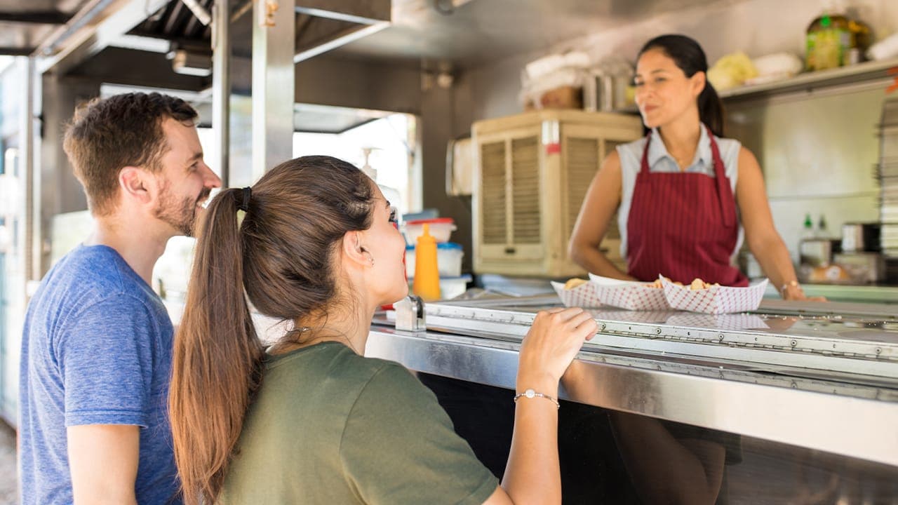 Customers ordering food at New Jersey food truck.