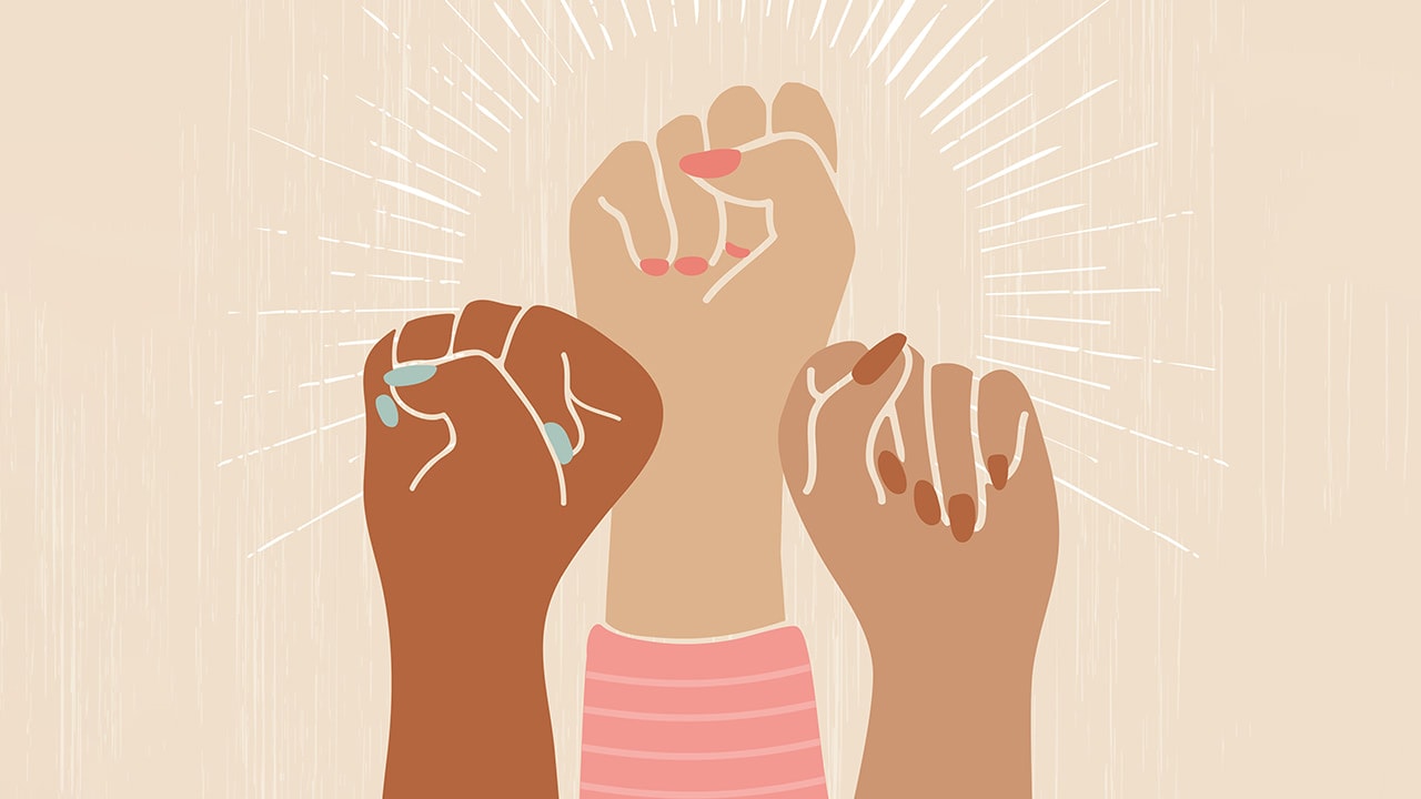 Digital illustration of three female fists raised in the spirit of women's empowerment.