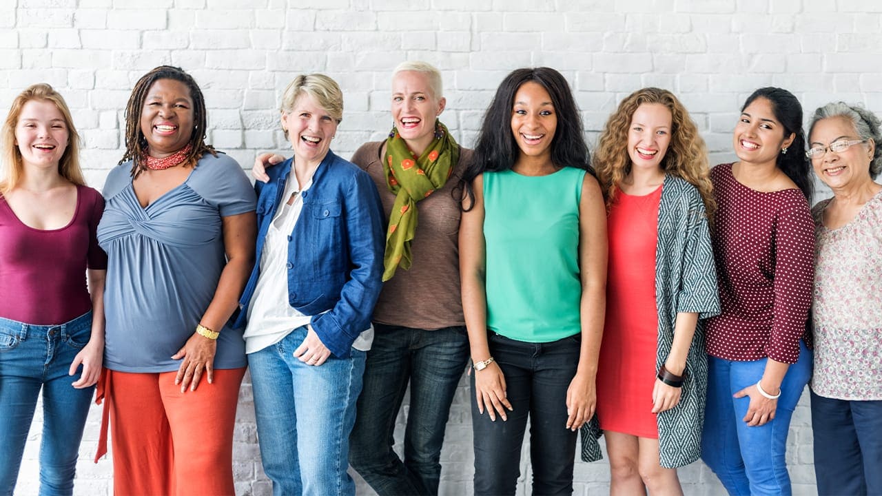 Diverse group of New Jersey resident women posing for group photograph. Image produced by More Jersey.