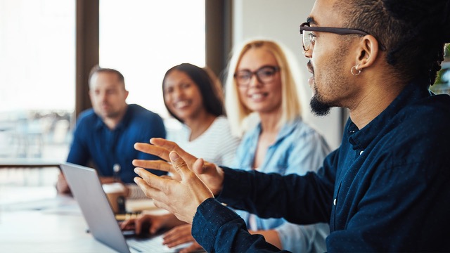 Diverse group of residents engaged in a discussion at a New Jersey meetup event.