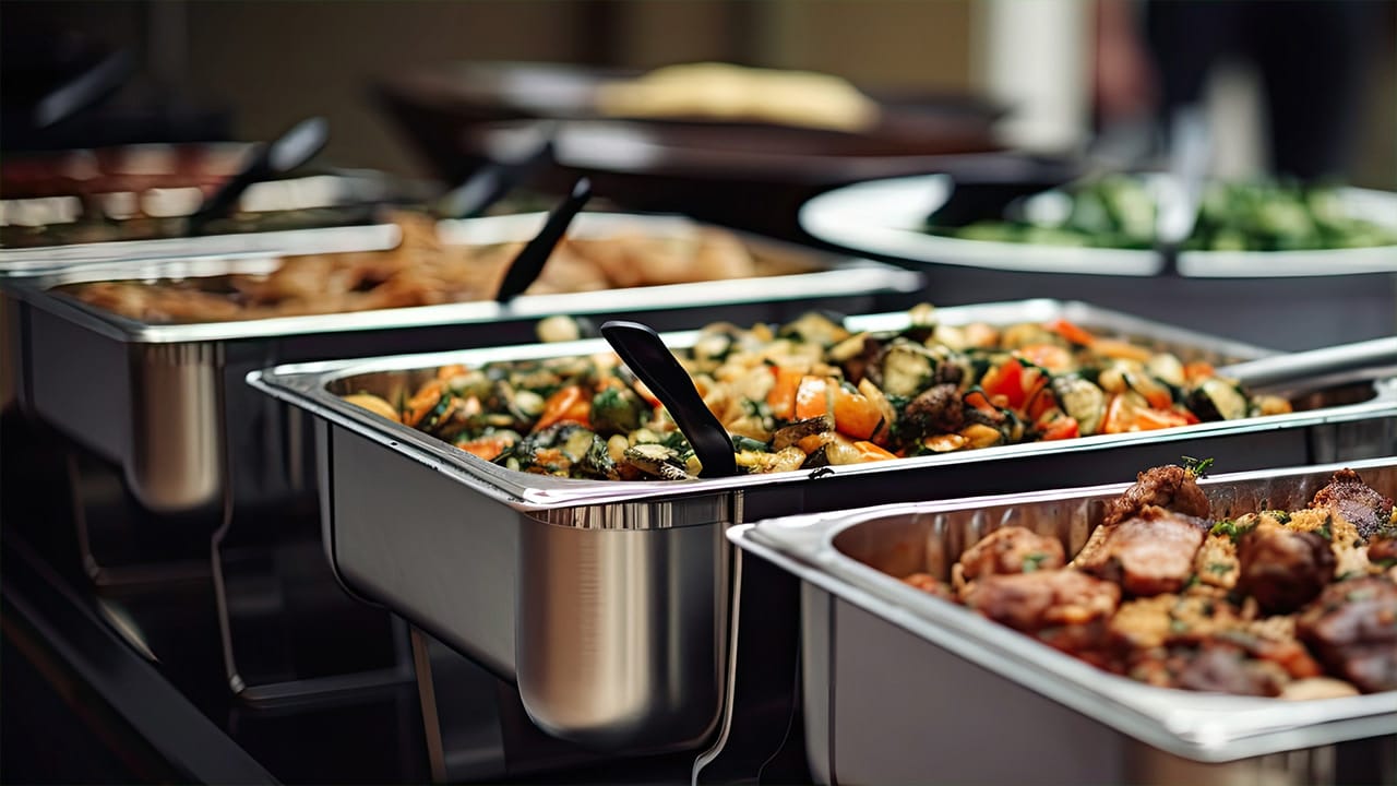 Elegant catering presentation at New Jersey event with chafer dishes filled with a variety of savory entrees.