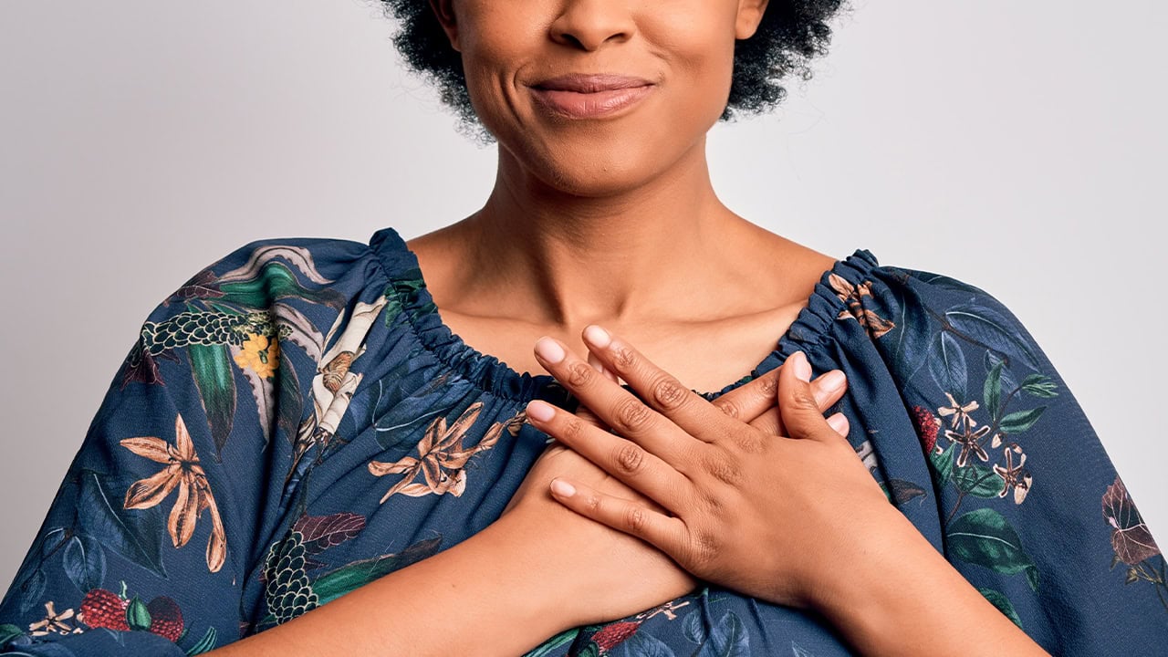 African American woman with hands over heart gesturing she cares about opportunities to Give Local in New Jersey. Image produced by More Jersey.