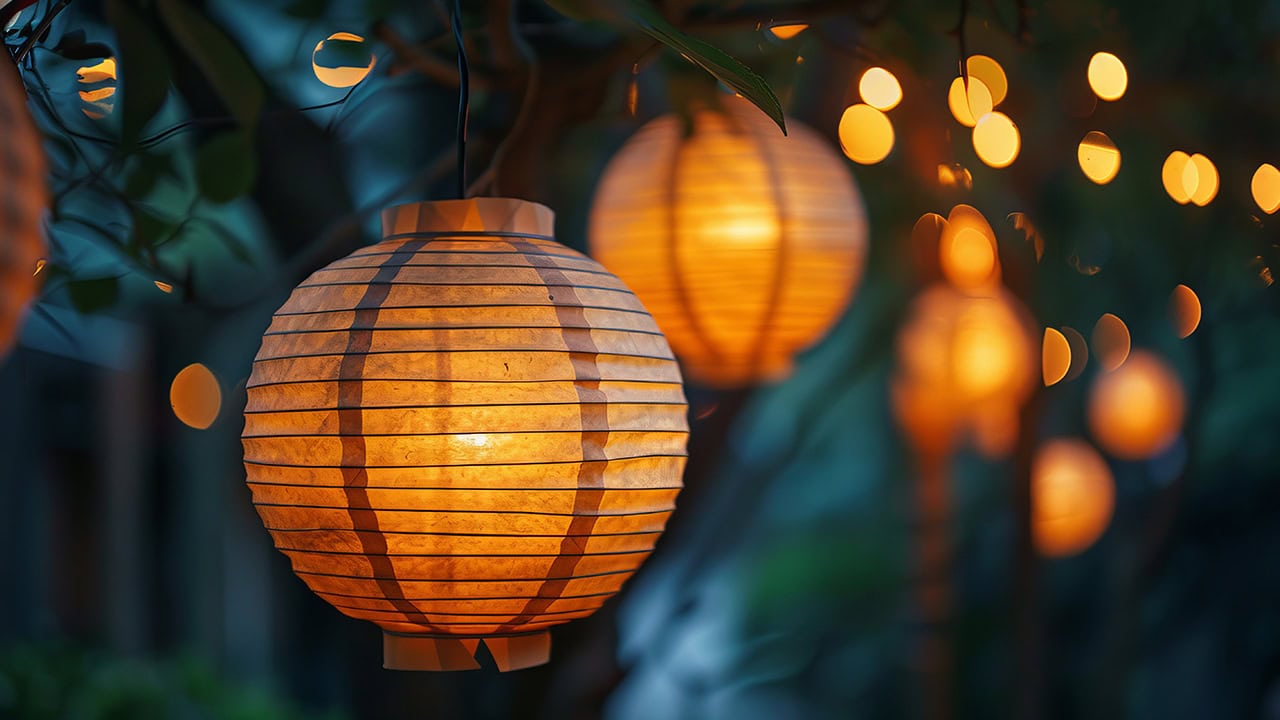 Glowing round paper lanterns.