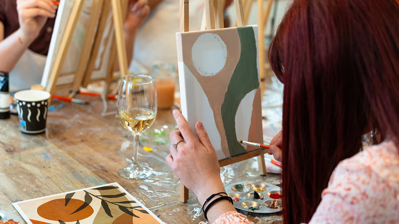 Group enjoying a New Jersey paint and sip event. Image produced by More Jersey.