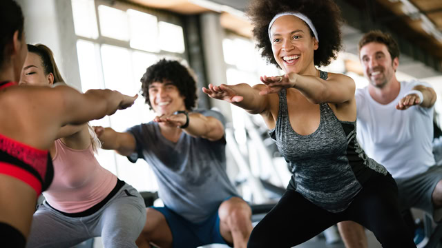 Group of diverse residents exercising at a local gym.