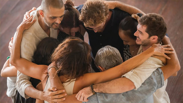 Group of New Jersey residents hugging after support group meeting.