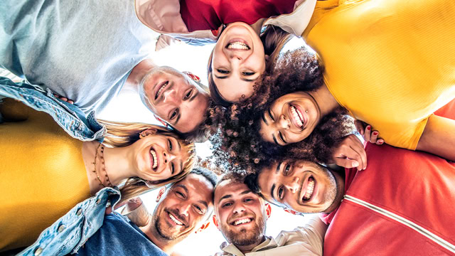 Group of New Jersey young adults doing a group hug.