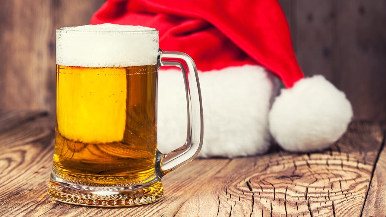 Mug of beer with Santa's hat at New Jersey bar. Image produced by More Jersey.