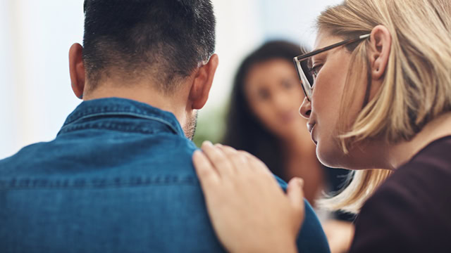 New Jersey Group therapy session participants providing emotional support.