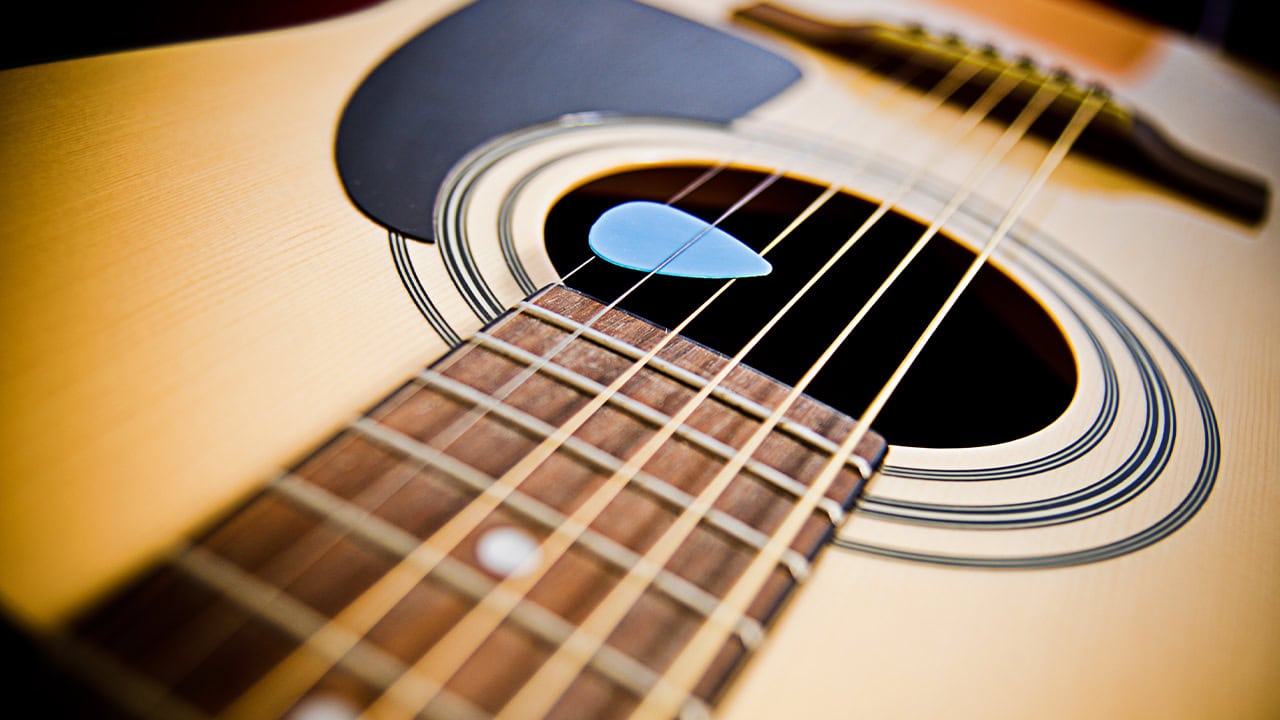 Close-up of an acoustic guitar.  Image produced by More Jersey.