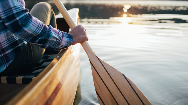 Close-up of a New Jersey resident canoeing in a lake.