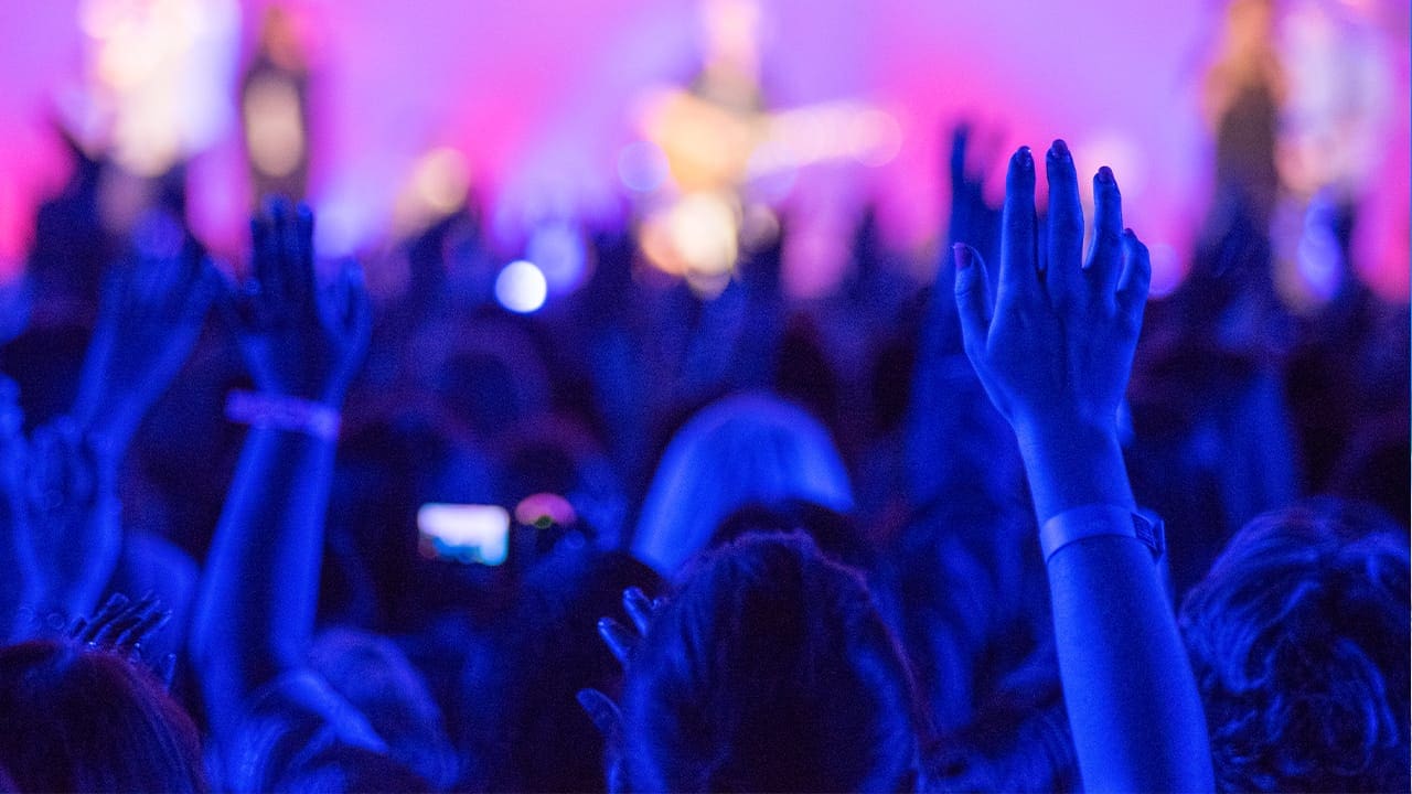 New Jersey Christian worshiping with raised hands.