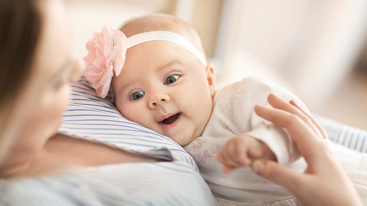 New Jersey mother holding baby daughter.