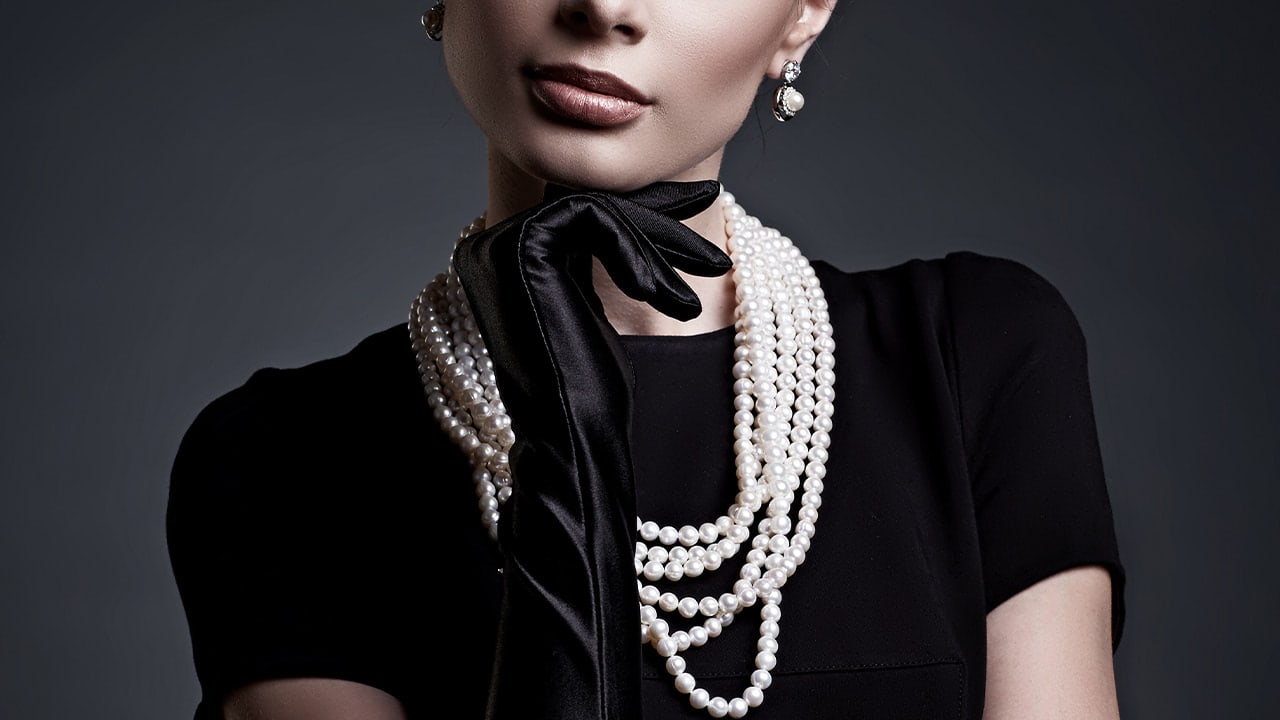 New Jersey resident dressed in a retro high fashion black dress and gloves outfit.