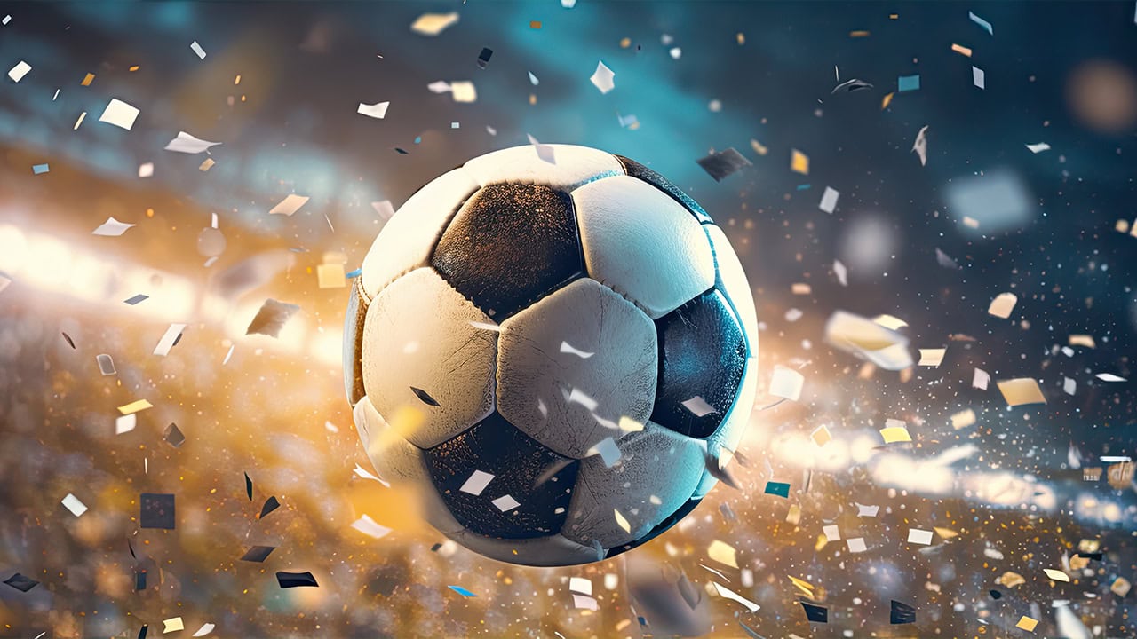 Soccer ball in air with falling confetti for game winning goal.