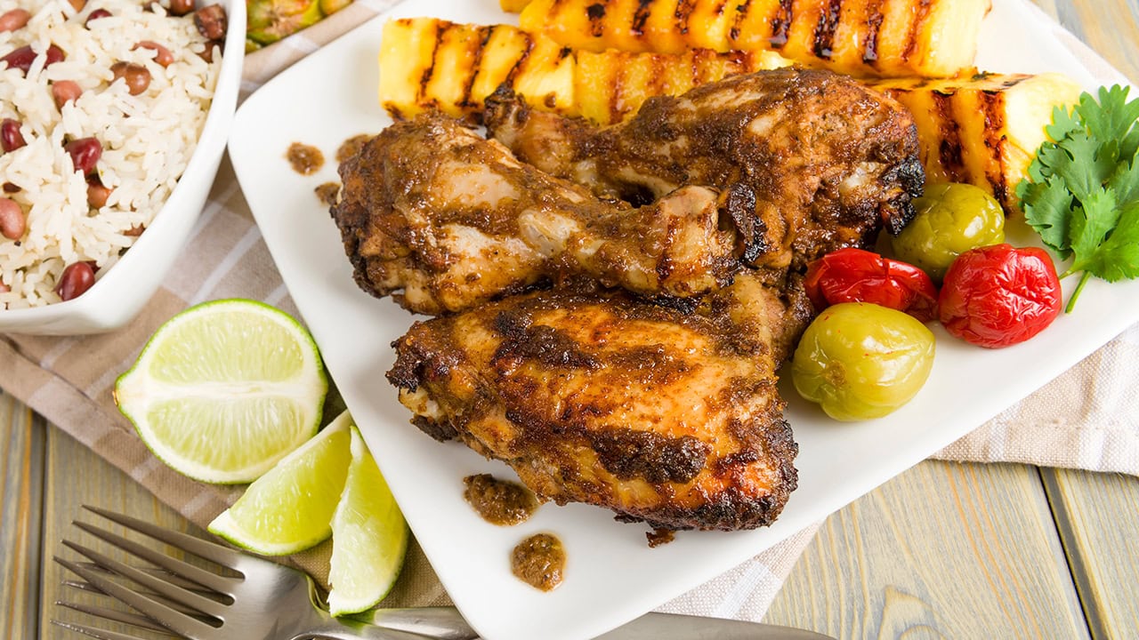 Plate of jerk chicken. Image produced by More Jersey.