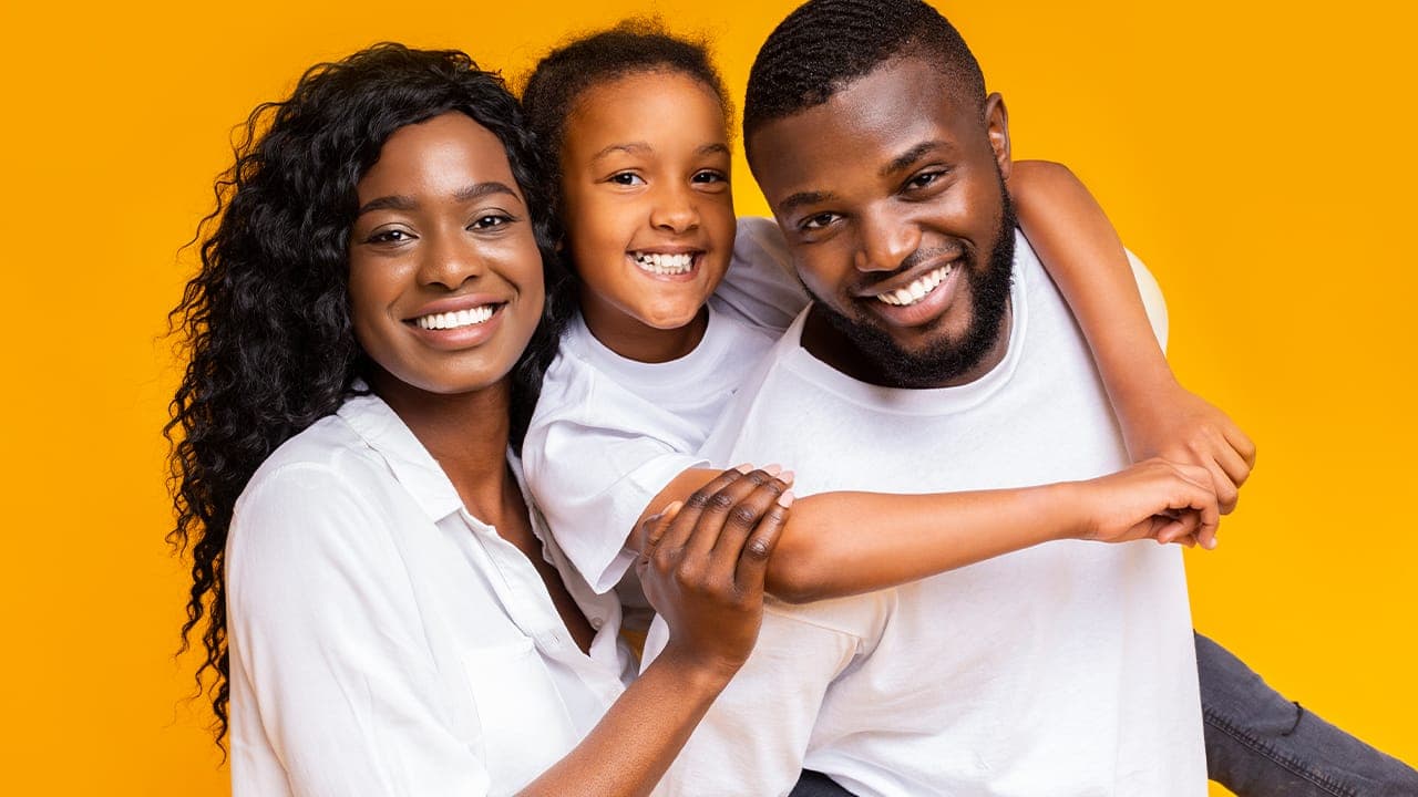 Portrait of beautiful black family of three.