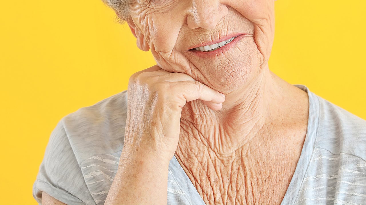 Portrait of senior woman with hand on chin. Image produced by More Jersey.