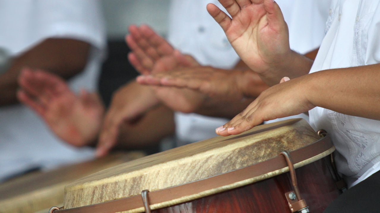 Residents playing Puerto Rican folk music on Latin drums. Image produced by More Jersey.