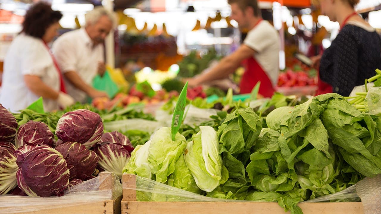 Residents purchasing fresh vegetables at New Jersey farmers' market. Image produced by More Jersey.