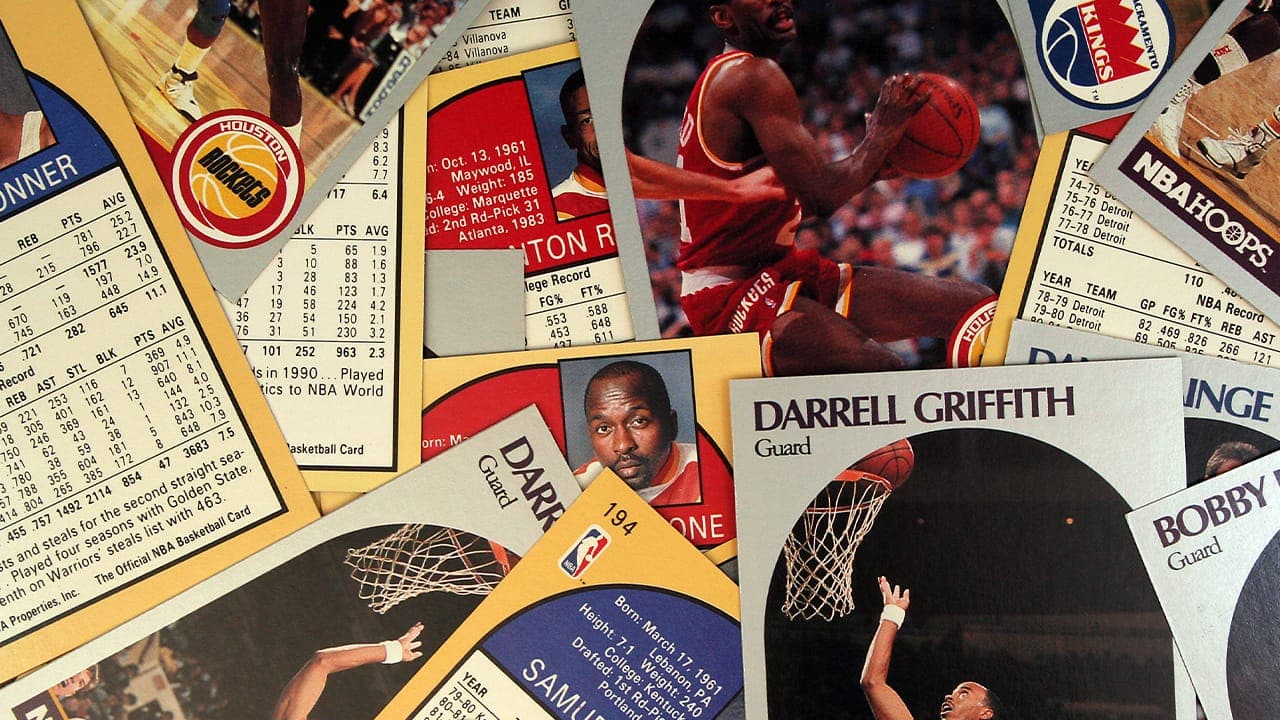 Scattered classic basketball trading cards.