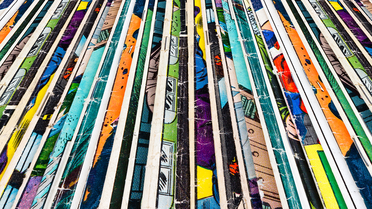 Stack of vintage comic books at New Jersey comic festival. Image produced by More Jersey.