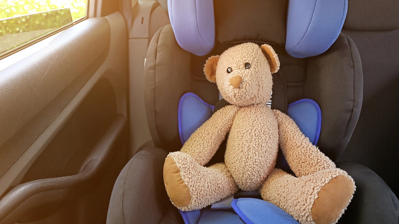 Toy bear on child car safety seat. Image produced by More Jersey.