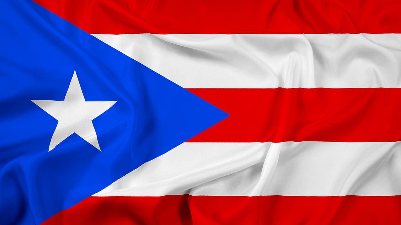 Waving Puerto Rico flag.