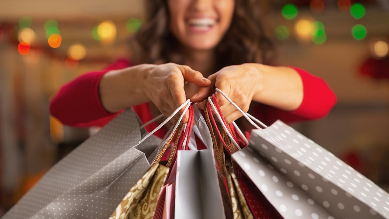 Woman with shopping bags at New Jersey Christmas holiday marketplace. Image produced by More Jersey.