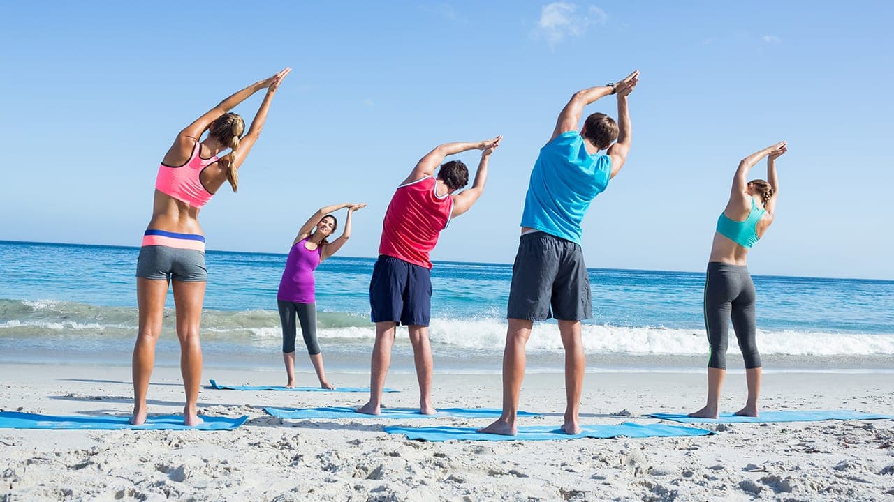 Yoga class held outdoors at New Jersey beach.